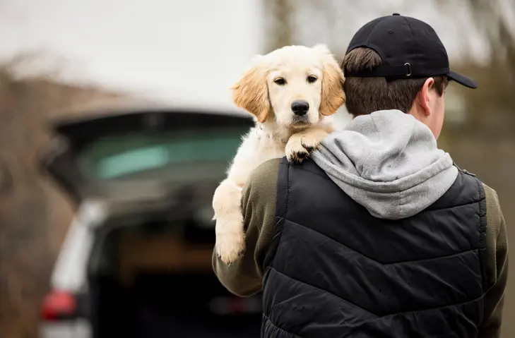 man holding dog