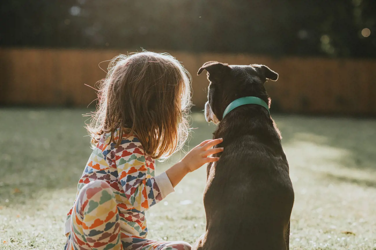 A Child And Dog Together