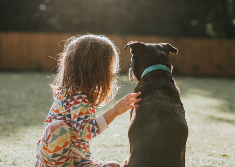 A Child And Dog Together