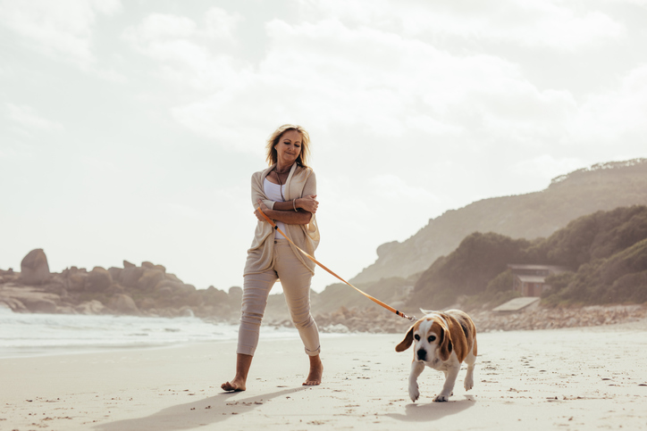 Woman walking dog