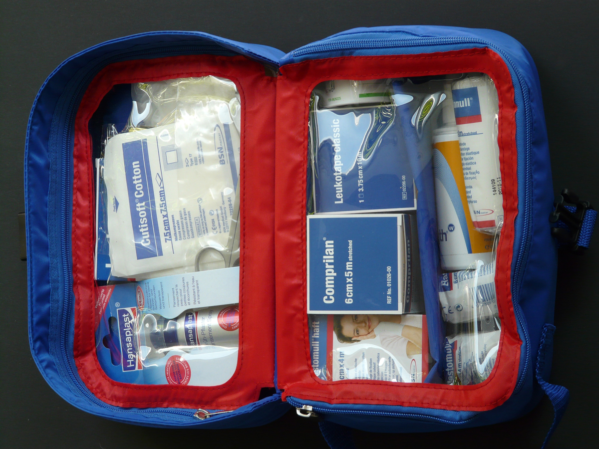 A first aid kit open with its content on display