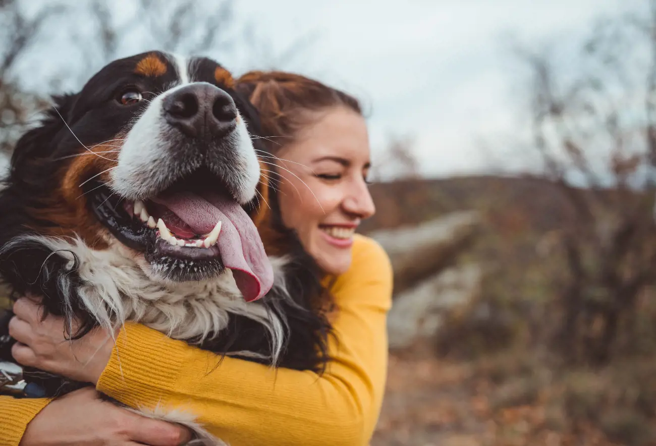 Woman Hugging Her Dog