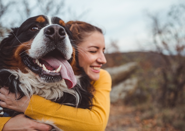 Woman Hugging Her Dog